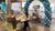 Two people brainstorming at a table, with a balloon arch and popcorn stand in the back