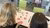 Two students photographed over their shoulder while they are creating their ideal campus with sticky notes.