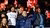 Supporters bij Excelsior protesteren tegen racisme met flyers en t-shirts met slogans "#ik sta op tegen racisme"