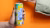 Product image of a person holding the Mojo Maté drink with an orange background