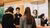 Ambassador explains to prospective students during the Master Open Day.