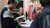Ambassador talking to a prospective student during the Master Open Day.