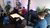 People sitting in room together