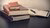 Pile of thick law books stacked up on a table.