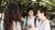 Students talking outside on campus.