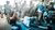 Two festival-goers sit on the ground having fun in a festival tent during Lowlands 2023. 