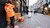 Thuisbezorgd delivery person waiting for take out to deliver in the city.