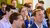  people sitting in a crowd