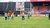 Alumni carrying a goal onto the field of Excelsior