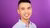 Portrait photo of Huije Wang with purple background.