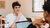 EUC student with laptop smiling