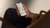 Person looking at ROOM to grow app on mobile phone.