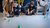 Children play a game on the ground accompanied by an adult during Weekend of Science.