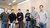 two people from optiver with four students that won the competition