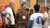 Three employees talking with each other at the Sustainability Summit 2024.