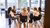 A group of employees are having a meeting, sitting in a circle.