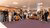 A large group of people gathered, looking at the camera