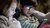 Two children using a smartphone together.