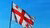 Flag of Georgia on Blue Sky Background