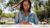 A young woman is using the Libby app on her phone 