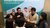 Students talking around table