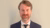 Associate Professor Aart Gerritsen against a beige background