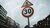 Red and White road signs under gloomy sky