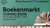 Een groene 'banner' met de aankondiging van de boekenmarkt in zwarte tekst