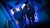 People walking up the stairs with dimmed blue light