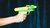 Colorful toy water gun being sprayed