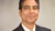 Yubraj Acharya looks into the camera.