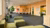 The Erasmus Hub interior: an open space with green couches