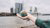 a hand holding a mini globe