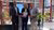 Rector Magnificus Jantine Schuit holding up a booklet saying 'Diamonds for Rotterdam', in the presence of 2 other men