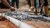 Workers laying cement on a mold