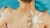 Boy's back with a sun drawn on it with white sunscreen