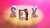 The letters S, E, X, and a doll-couple kissing