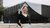 Girl in black sweater smiling, standing in front of Erasmus Paviljoen