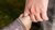 Person holding children's hand