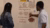 students discussing poster