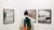 One person with a colourful jacket is standing in front of three artworks with their back towards us.