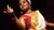 Student in traditional indian clothing performs a classical dance