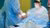 Surgical mask on medical device, surgeons blurred in background
