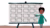 Person in green pointing at a large blank grid board on a stand