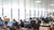 A big open workspace with people working behind desks