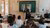 A professor teaching without a gown.
