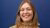 Picture of alumna Mare Dermaux in front of dark blue background