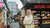 Young girl standing inside of Blaak market food court