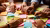 Multiple hands sorting bright sticky notes on table during brainstorming