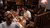 Students around table in conversation